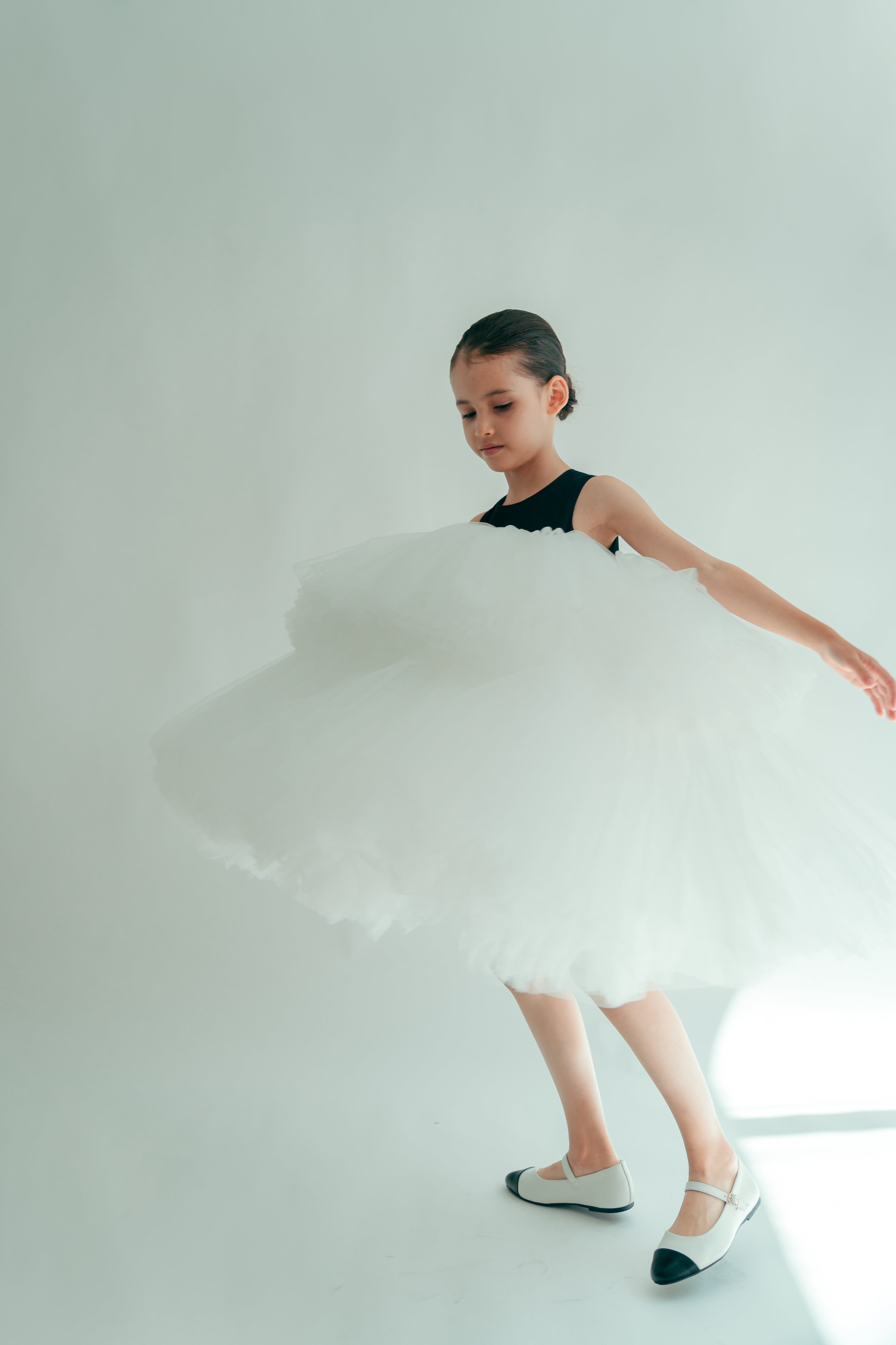 Girl twirling wearing a bicolor A line dress