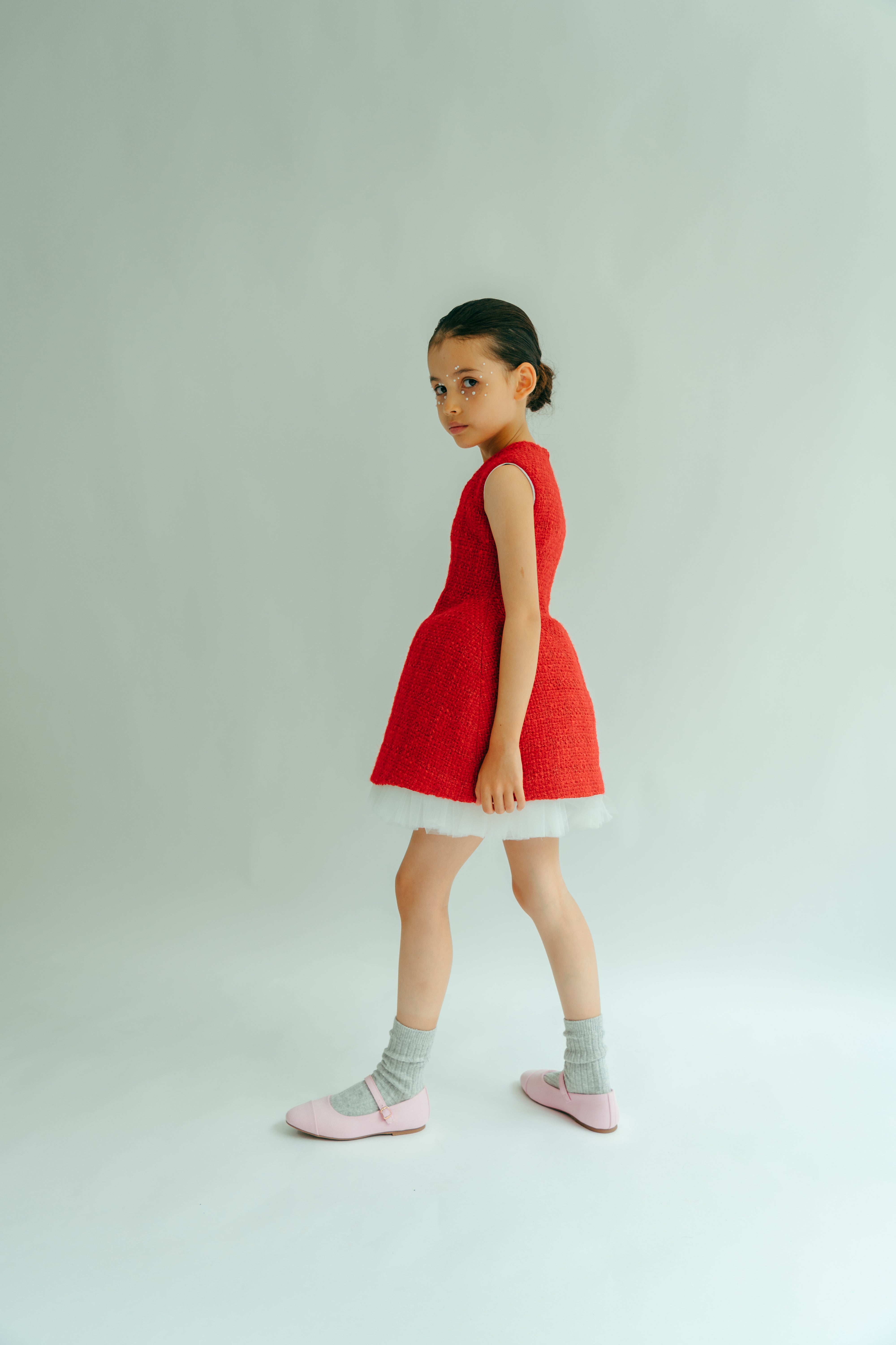 Young girl wearing the Ivy classical dress in red
